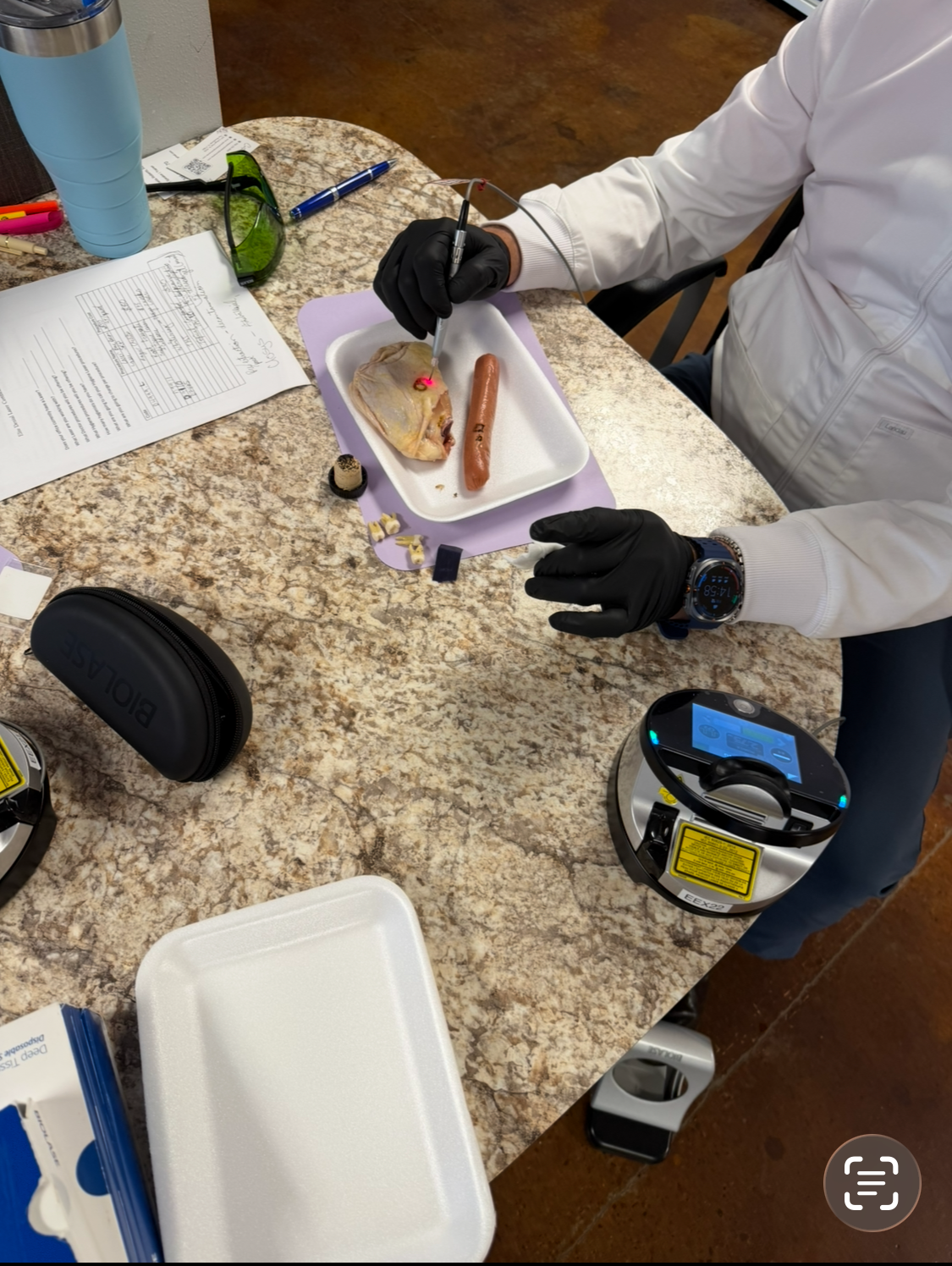 Dental workshop participants practicing laser skills during certification training